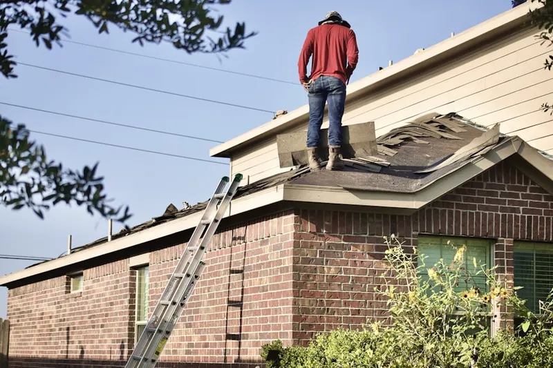 Professional roofer working on a residential roof in Rancho Calaveras